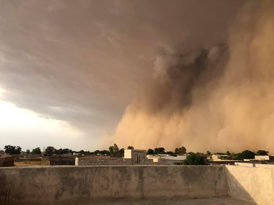 A dust squall sweeping over a city